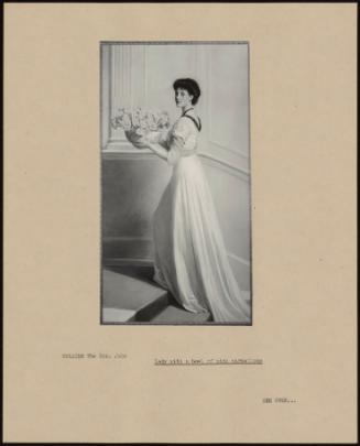 Lady With A Bowl Of Pink Carnations